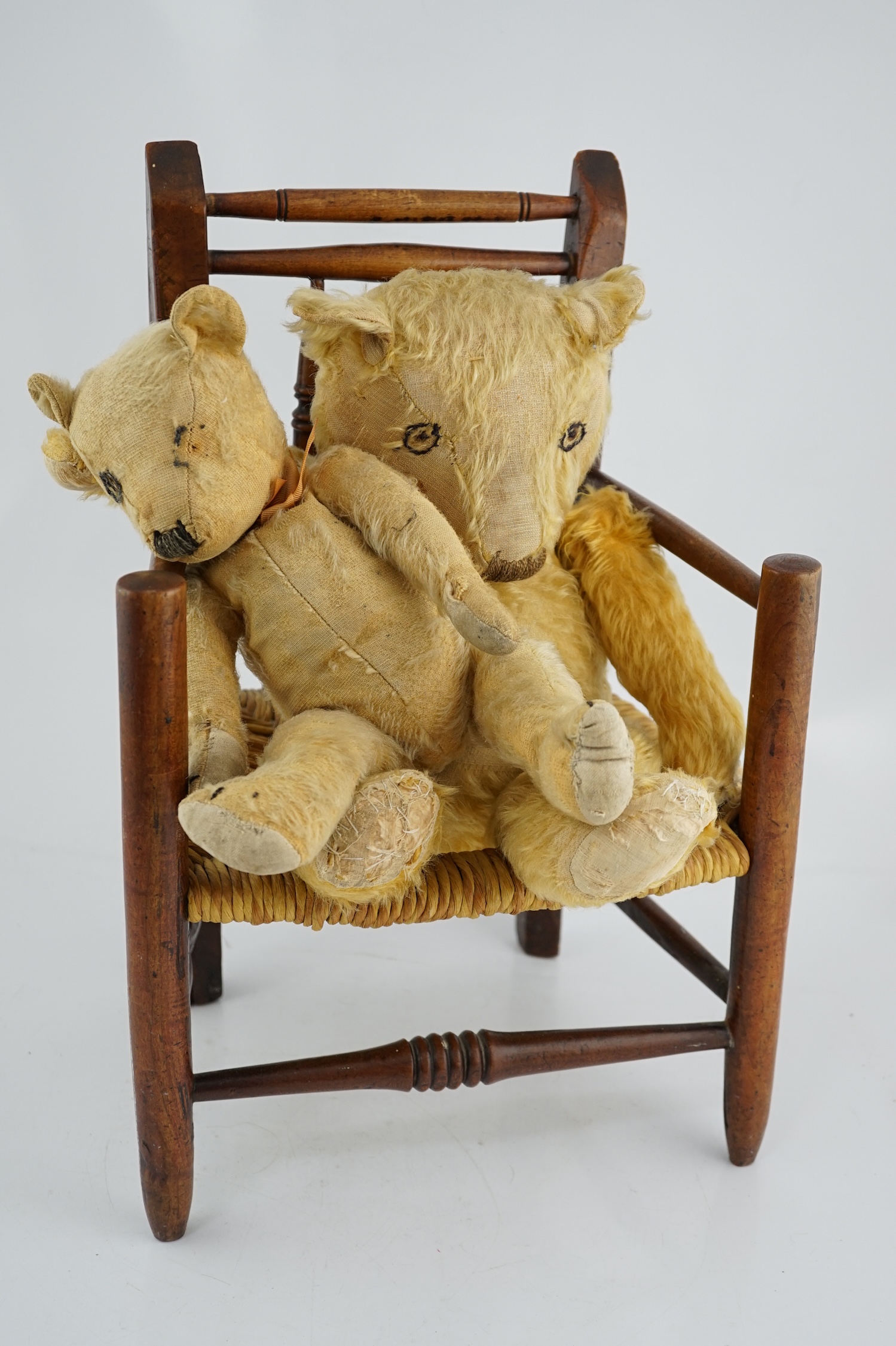 Two teddy bears and a child's chair